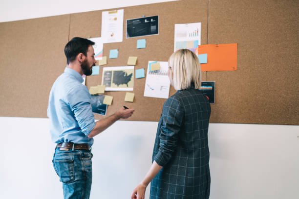 istock Colleagues discussing new project in office 1417378826