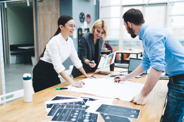 istock Colleagues discussing charts and diagrams 1417379249