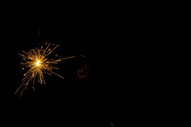 istock hand holding a burning sparkler 1417380987