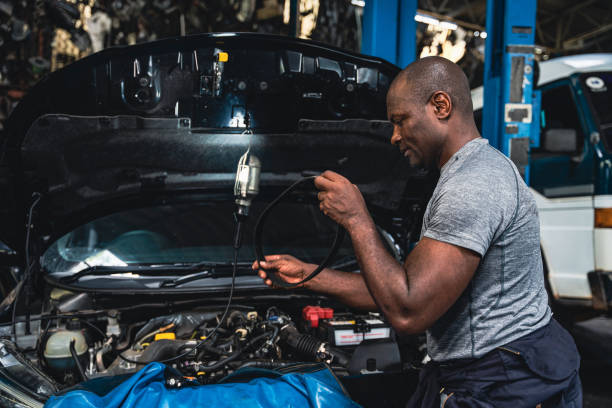 istock Male mechanic changing new belt for car. 1417382249