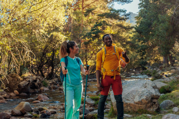 istock Cheerful hikers walking in wilderness 1417382822