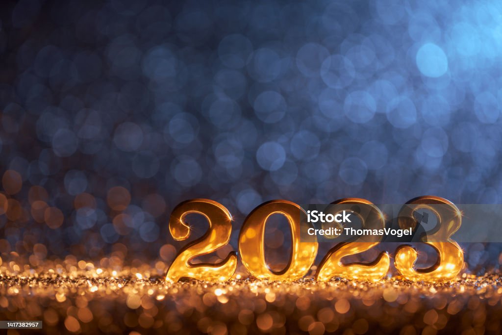 New Year Decoration 2023 - Gold Blue Party Celebration Christmas Shiny, golden number 2023 and on glitter and defocused lights. Native image size: 7952x5304 2023 Stock Photo