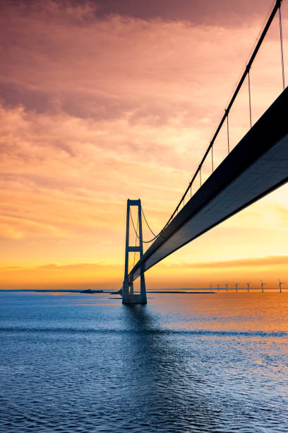 Great Belt Suspension Bridge at Sunset, Denmark Great Belt Suspension Bridge at Sunset, Denmark zealand denmark stock pictures, royalty-free photos & images