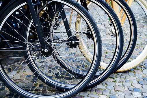Close-Up Of Bicycles Parked On Paving Stone