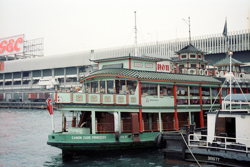 British Hong Kong, China - 1983: A vintage 1980's Fujifilm negative film scan of the Canon Jade Princess, a tour boat, at Ocean Terminal, built in 1972 and originally named the \