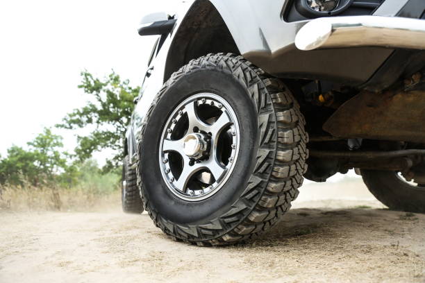istock mud tire close up is on off road car. 1417385618