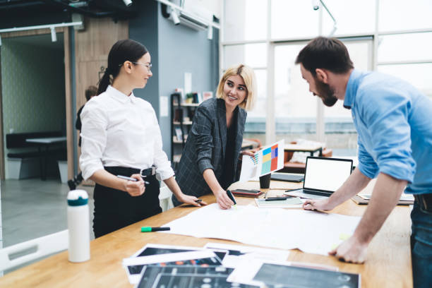 istock Colleagues with smile working in office 1417387640