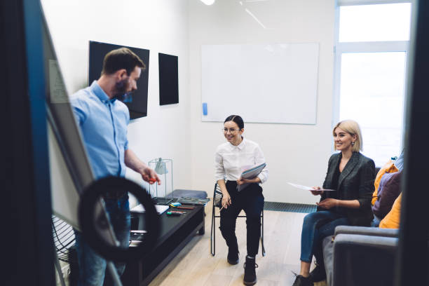 istock Young study group of entrepreneurs smiling on business seminar at office 1417387682