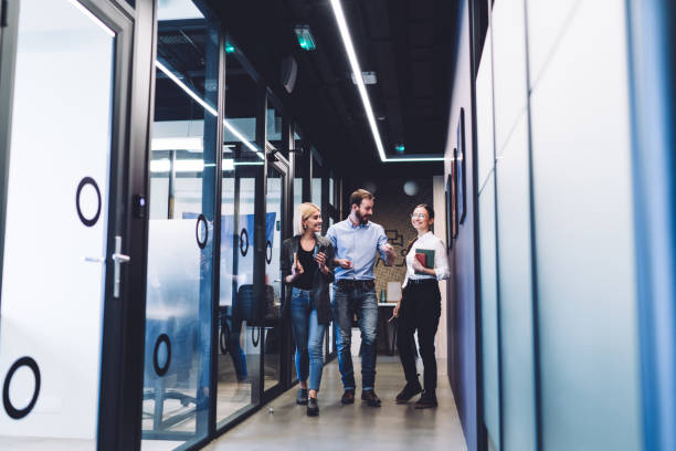 istock Happy young coworkers walking on meeting 1417387722