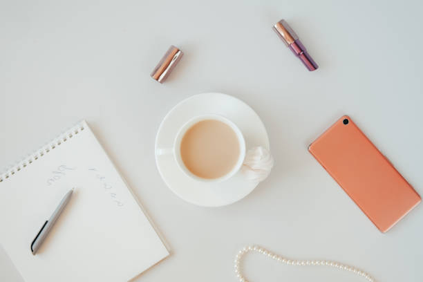 istock Modern home office concept. Computer, coffee and flowers. 1417389812