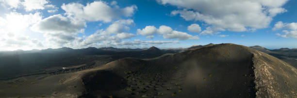istock black volcano from aerial view with vineyards inside 1417390348