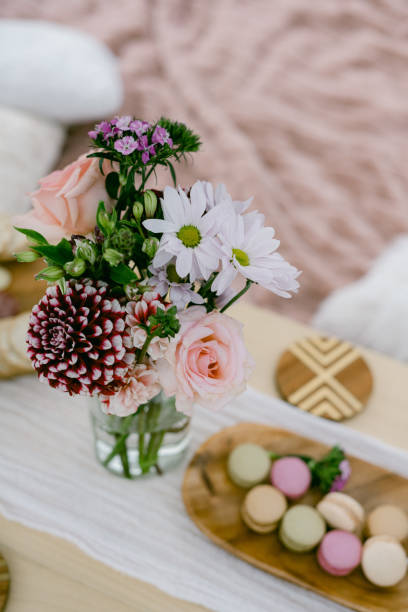 istock flowers and macarons on a picnic setting 1417392380