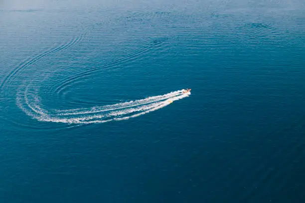 Speedboat with donut water-sports in Antisamos beach, Kefalonia in Sami, Greece