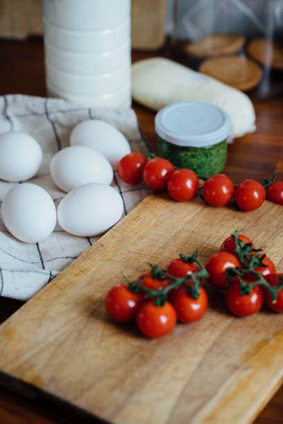istock Ingredients for cooking: milk, eggs, tomatoes and cheese 1417395593