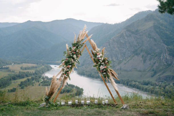 istock Wedding arch in the shape of a triangle with flowers 1417395812