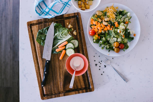 Fresh and healthy green mixed salad prepared in white kitchen in Gurnee, Illinois, United States