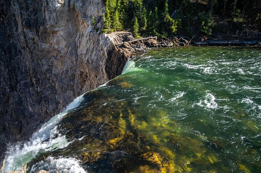 A narrow stream of water in Yellowstone National Park, Wyoming in Yellowstone National Park, Wyoming, United States