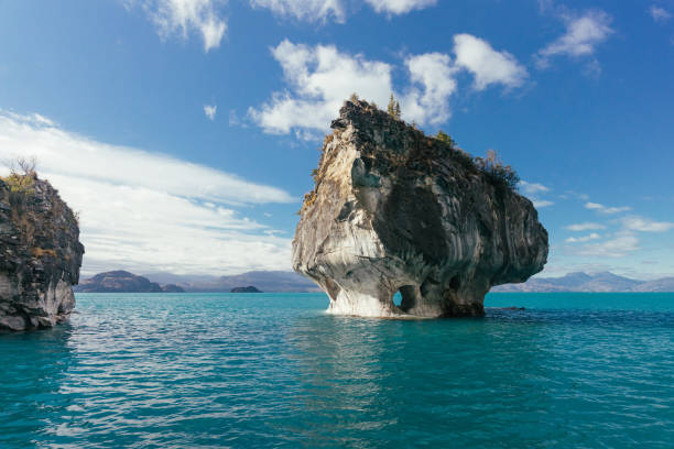 Marble Chapel surrounded by turquoise pristine lake water. Marble Chapel surrounded by turquoise pristine lake water. in Puerto Río Tranquilo, Aysén, Chile marble caves patagonia chile stock pictures, royalty-free photos & images