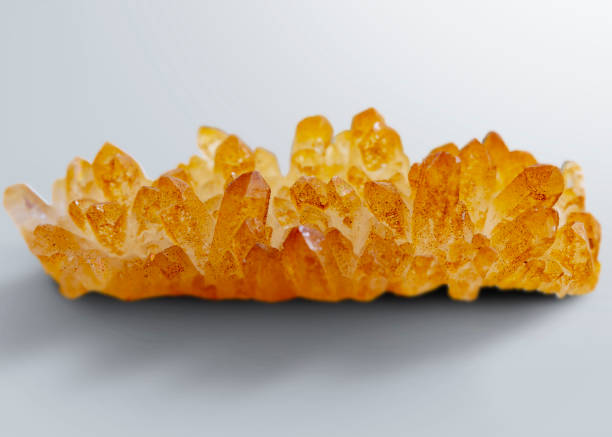 Huge illuminated transparent quartz crystals on green background. The image was captured as close-up image.