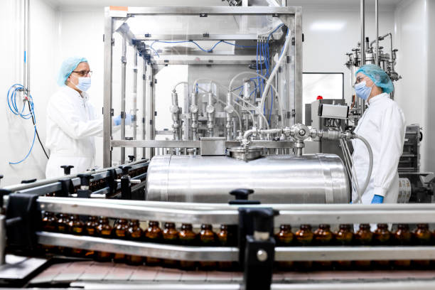 istock Pharmaceutical bottles seen arranged properly during the manufacturing in a pharmaceutical industry 1417397601