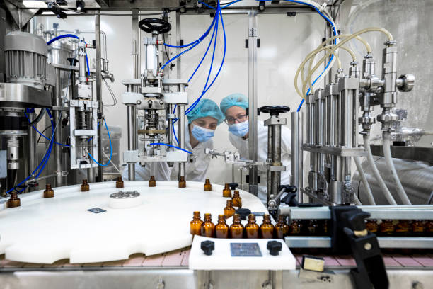istock Pharmaceutical bottles seen arranged properly during the manufacturing in a pharmaceutical industry 1417397934