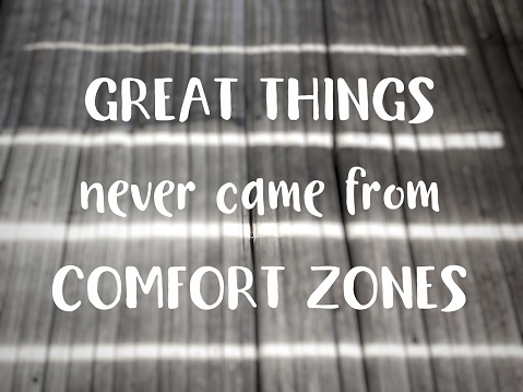 Inspirational Motivational Quote Concept - Great things never came from comfort zones in vintage background.