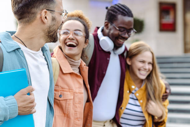 istock Cheerful Multi-ethnic group of students on the street 1417403374