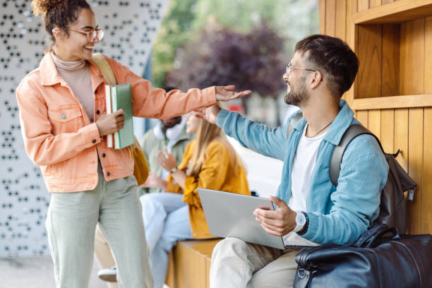 istock Young people hanging out after class. Students life 1417403513