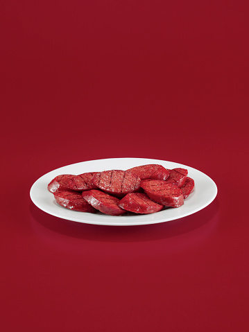 sausage plate on red background