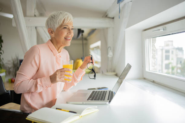 istock Senior woman working from home 1417409446