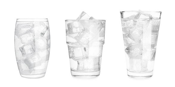 Set with different glasses of soda water with ice on white background. Banner design