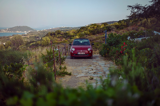 08/20/2022, Izmir-Turkey: Fiat 500 car parked in a farms's garden in Karaburun Peninsula.