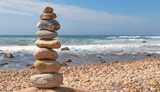istock Cairn at beach on sunny afternoon 1417417020