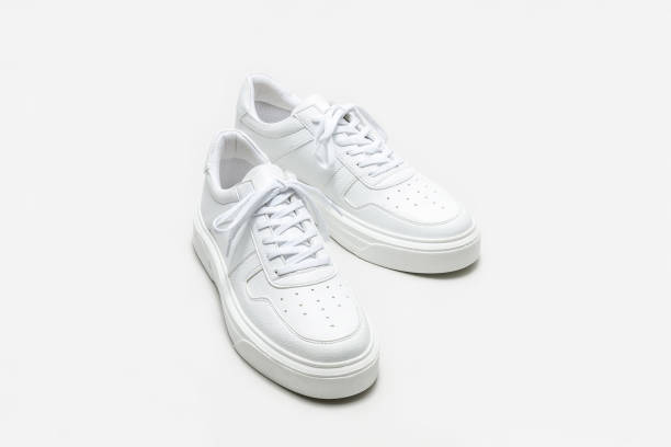 istock White leather sneakers on a white background 1417418141