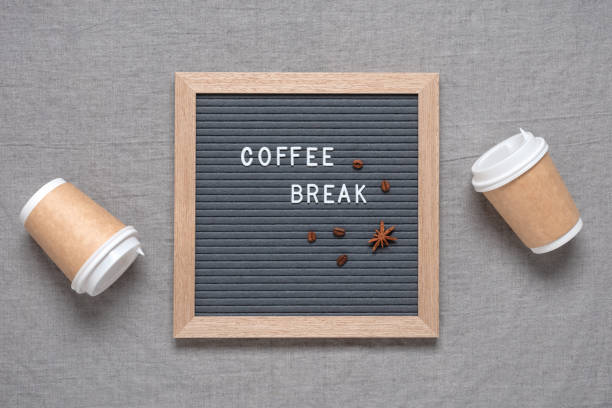 istock Coffee break text on letter board with paper cups flat lay. Gray linen textile background. View from above. 1417419349