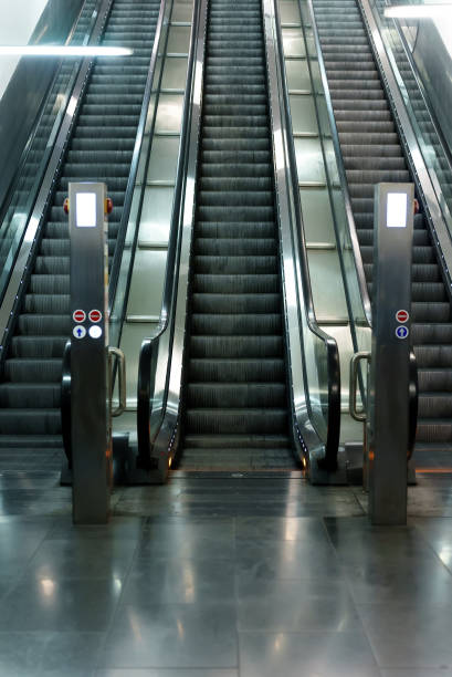 istock Electric escalator in metro. Moving staircase. 1417420383