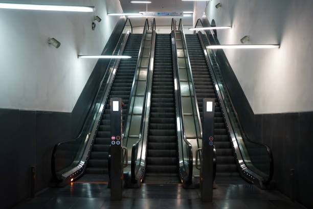 istock Electric escalator in metro. Moving staircase. 1417420413