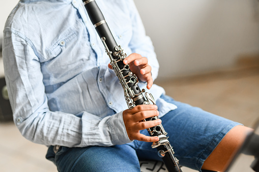 Boy Learning New Techniques On Clarinet