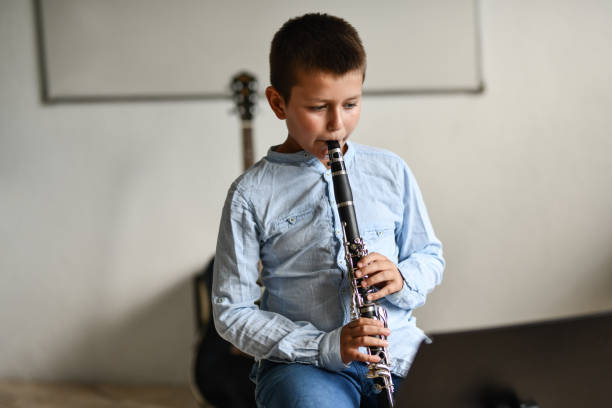 istock Child Reading Exercises And Playing Them On Clarinet 1417423269
