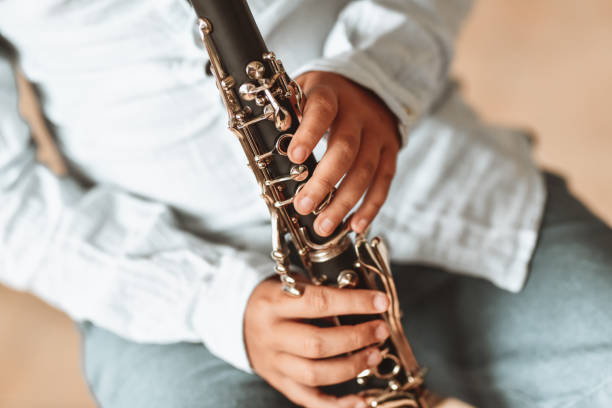Child Working On Improving Skills And Technique On Clarinet