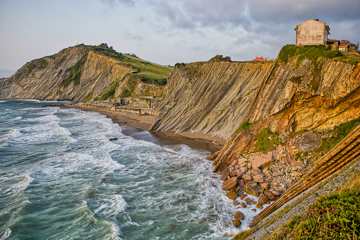 Sand dunes, beach and headland at sunrise in Pembrokeshire, Wales