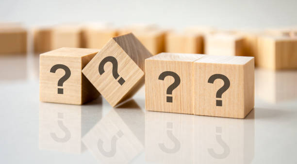 istock question mark shown on four wooden cubes on a grey background 1417425319