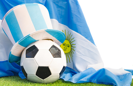 Soccer ball with the Argentine flag, on the grass of the field