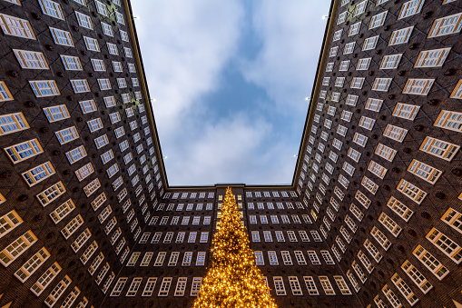 A courtyard of an old office building Hamburg - Germany.\nWith a famous christmas tree, installed during christmas time.