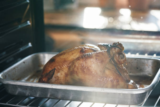 istock Roasting Chicken with Root Vegetables in the Oven 1417429922