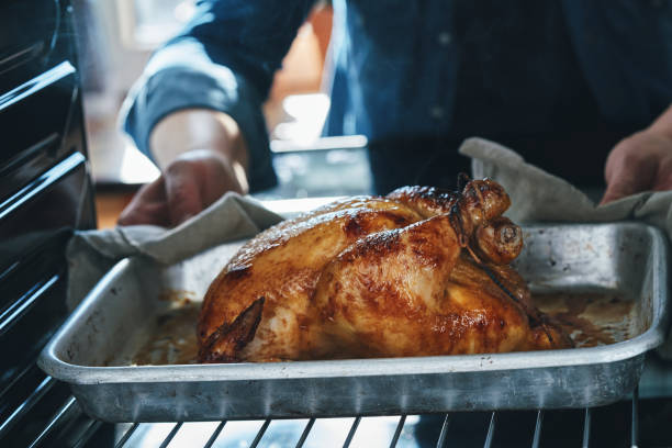 istock Roasting Chicken with Root Vegetables in the Oven 1417429924