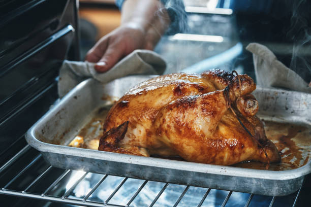istock Roasting Chicken with Root Vegetables in the Oven 1417429925