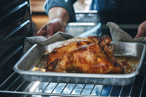 istock Roasting Chicken with Root Vegetables in the Oven 1417429930