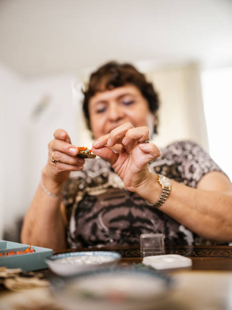 istock Senior disabled Latin woman doing arts and craft 1417433778