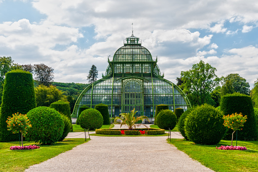 The palm tree greenhouse, in the park of the Schonbrunn imperial palace, one of the major tourist attractions in Vienna, Austria. August 9, 2022.